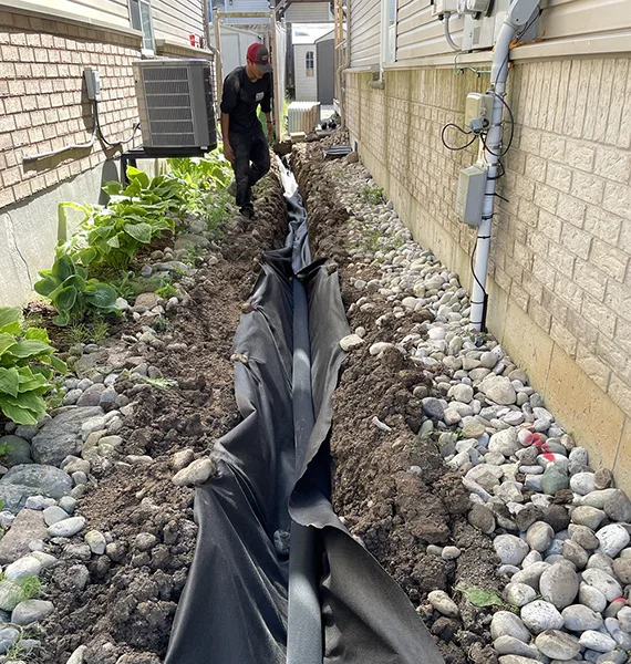Subsurface French drain installed along a canal-adjacent lot in Rotonda West FL