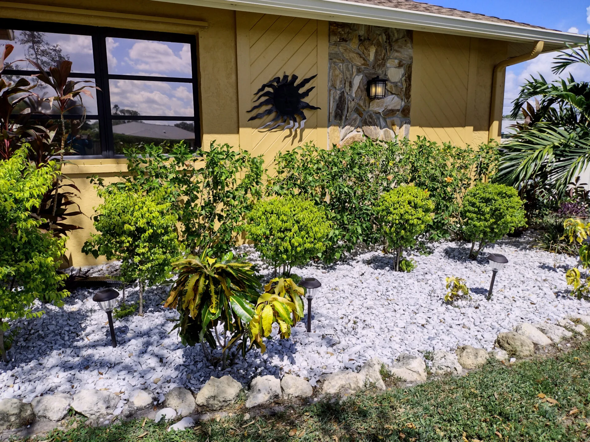 Renovated Port Charlotte backyard with rock beds and sod