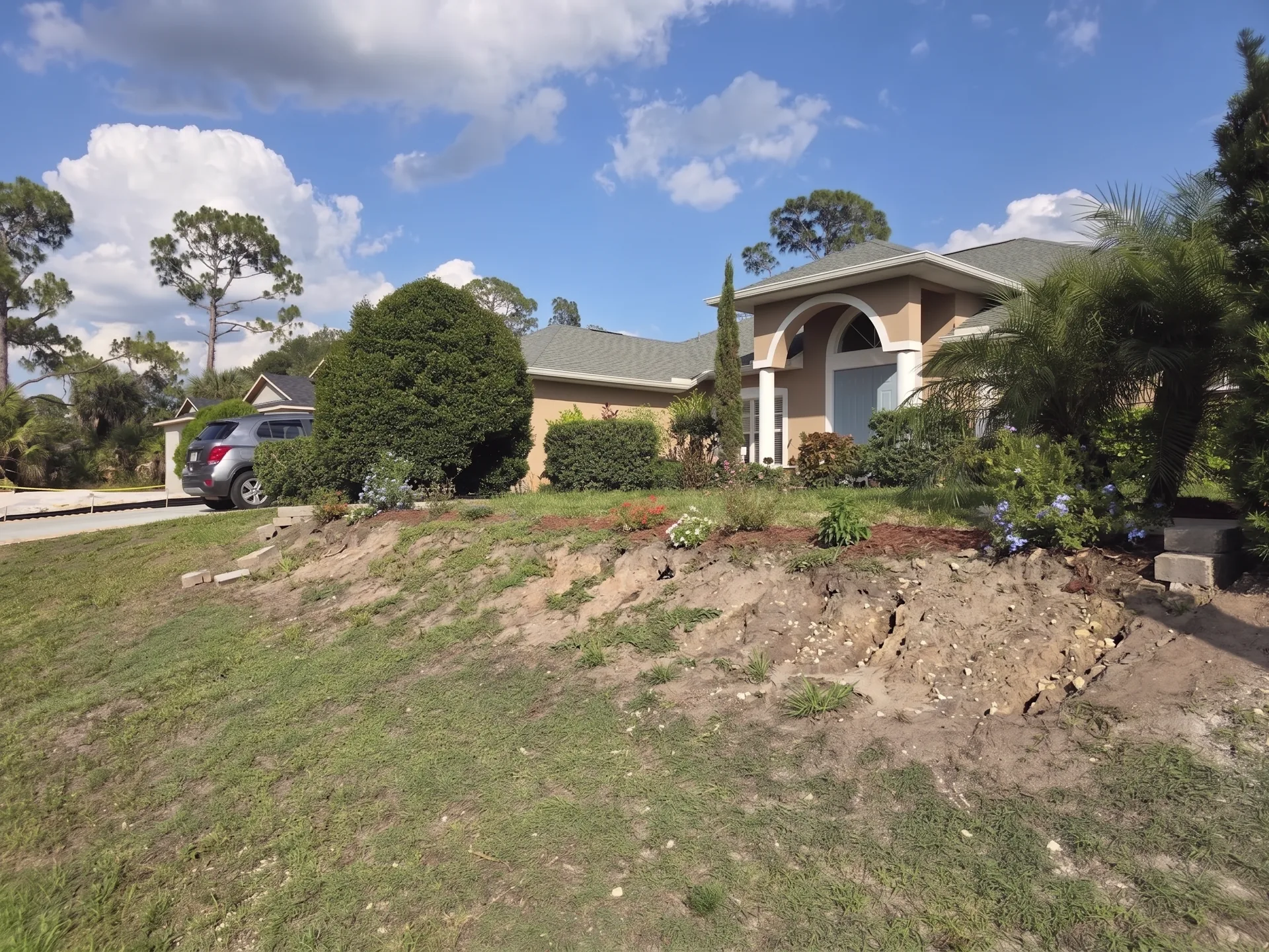 Eroding slope with no retaining structure before wall installation