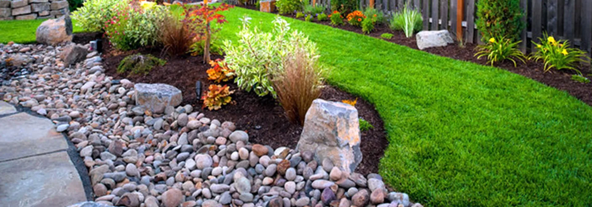 Rock installation in landscape beds in Southwest Florida — Epic Horizons